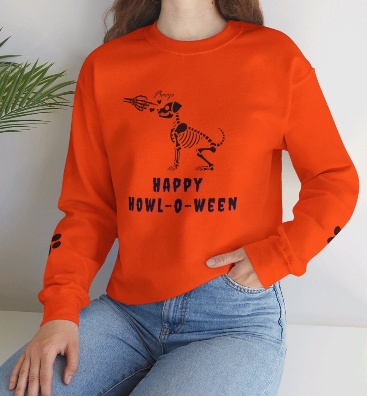 Boop! Happy Howl-O-Ween Dog Skeleton Orange Sweatshirt with Paw Prints on the Sleeves